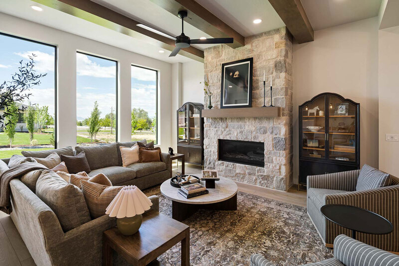 Down to Earth Projects<br>Symphony Homes Parade Ninth + North Design - Down to Earth Projects<br>Symphony Homes Parade Ninth + North Design - family room with large fireplace and sectional