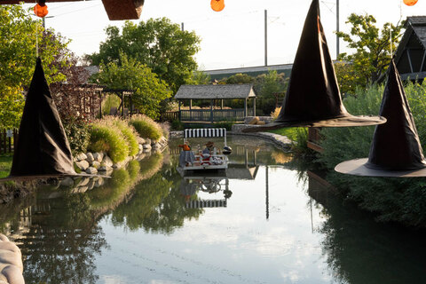Gardner Village Witch Displays - witch on a barge in the pond 