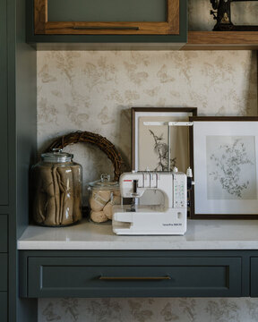 Down to Earth Projects | Utah Valley Parade at The Legacy at Meadow Ridge - sewing machine on counter with green cabinets 