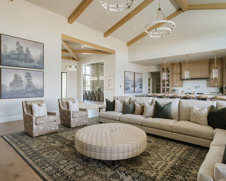 Down to Earth Projects | Utah Valley Parade at The Legacy at Meadow Ridge - family room and kitchen great room with wood ceiling beams and furniture from down to earth 