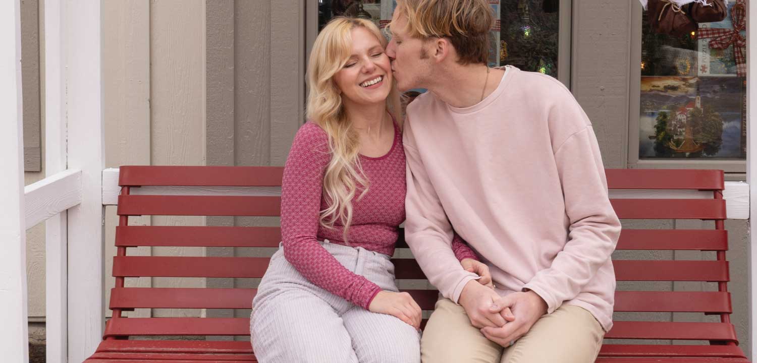 couple kissing by cupid