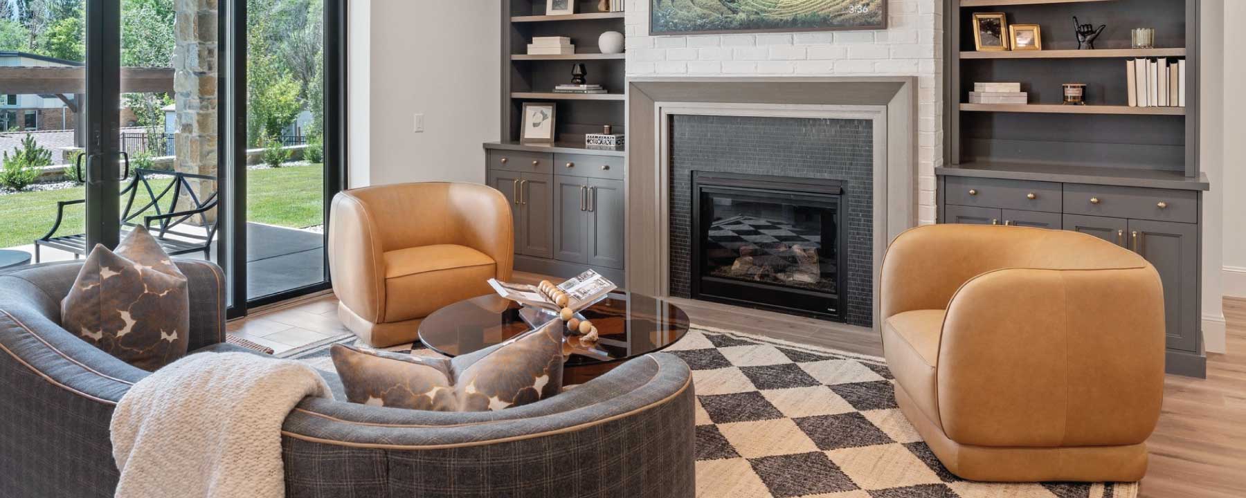 room with leather chairs and curved sofa